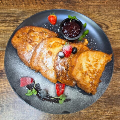 Hungarian sweet French toast with berry jam and fresh fruits