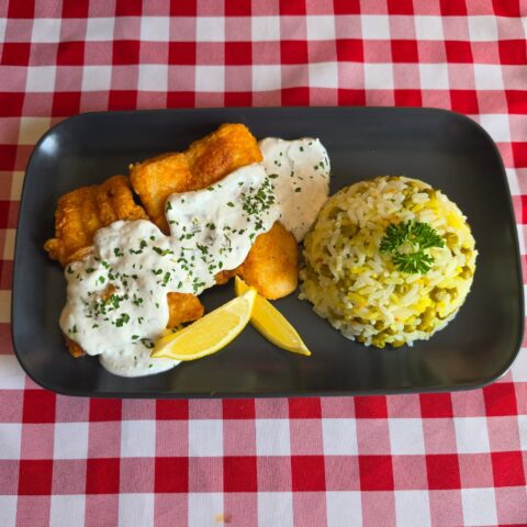 Paprika fish fillet served with rizibizi rice and peas