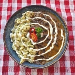 Bakonyi pork cutlet with creamy mushroom sauce and pasta