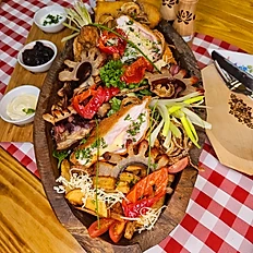 Hungarian sharing platter with Borzaska Gipsy Style Steak roasted knuckle fried cheese and sides